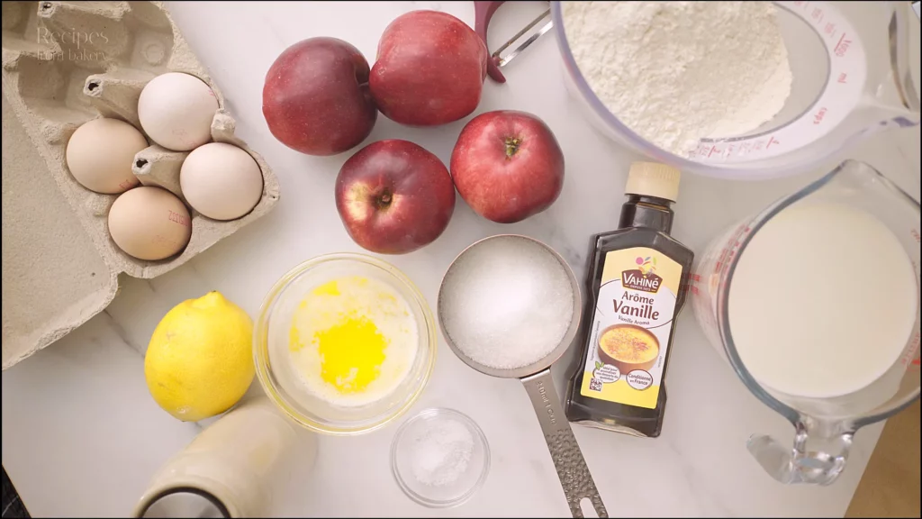 Ingrédients préparés sur la table : lait, pommes, œufs, sucre vanillé